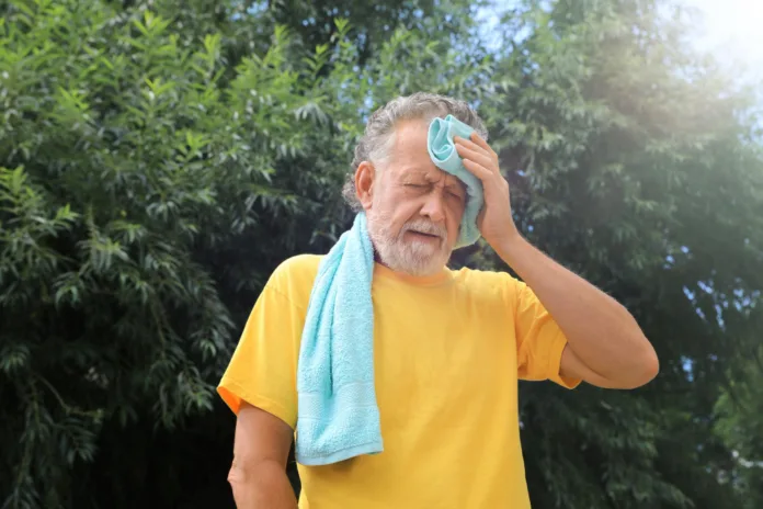 Man facing severe heatwave outdoors