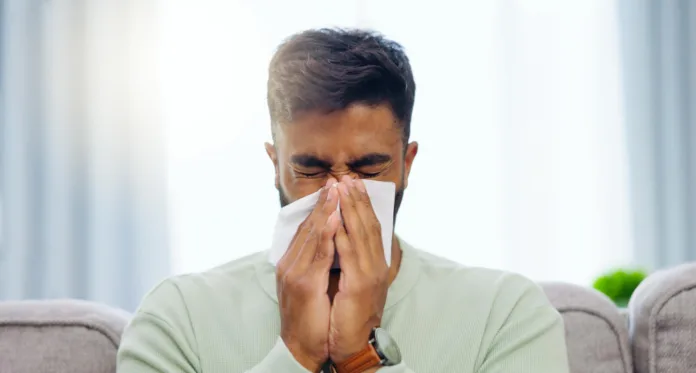 Person with Flu UK Virus Surge: Covid, Flu and Colds Rising Again