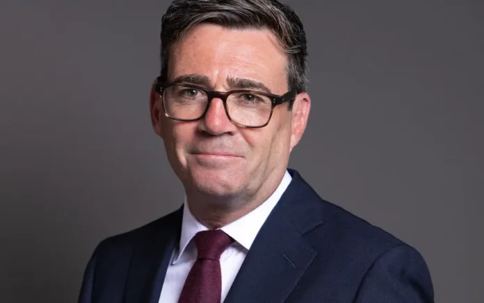 Andy Burnham in a formal suit and tie posing for an official portrait as Burnham welfare reform plans dominate UK political debate
