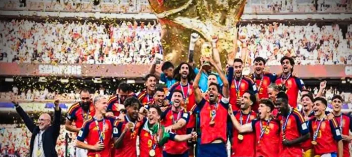 Spain players celebrate with the FIFA World Cup trophy after defeating Argentina 1-0 to win their second World Cup title in the 2026 final.