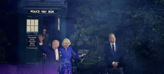 King Charles and Queen Camilla making a televised entrance in Glasgow beside a blue police box