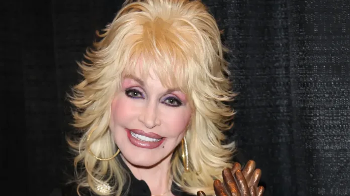 Dolly Parton pictured smiling at a public event