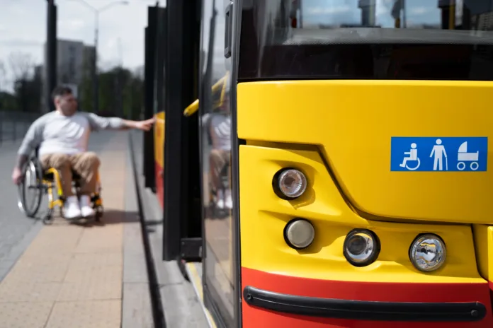 Disabled person baording the bus for traveling purpsoes