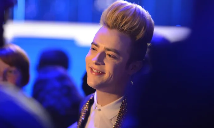 Jedward star Edward Grimes smiling at an event